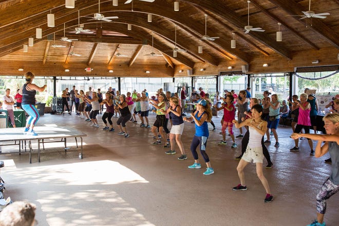 Residents take part in one of the many group exercise classes at the 2019 National Senior Health & Fitness Day event at the pavilion.