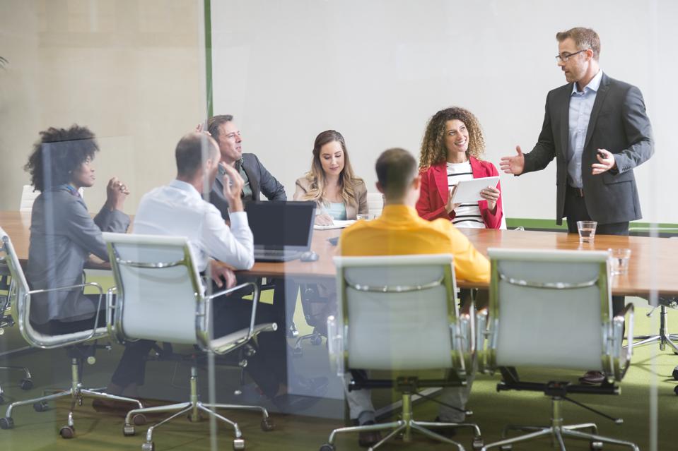 Businessman leading a meeting in boardroom