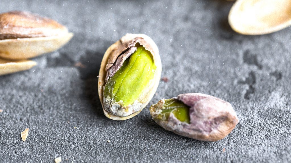 Partially peeled pistachio nuts