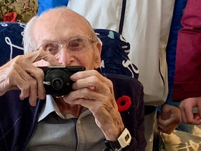 Canadian Second World War veteran Charlie Fisher, pictured, died last week at age 107. Fisher served in virtually all of Canada’s major European campaigns of the war, and came home with a unique collection of personal photographs that he snapped with a contraband personal camera. He is pictured with that camera here.